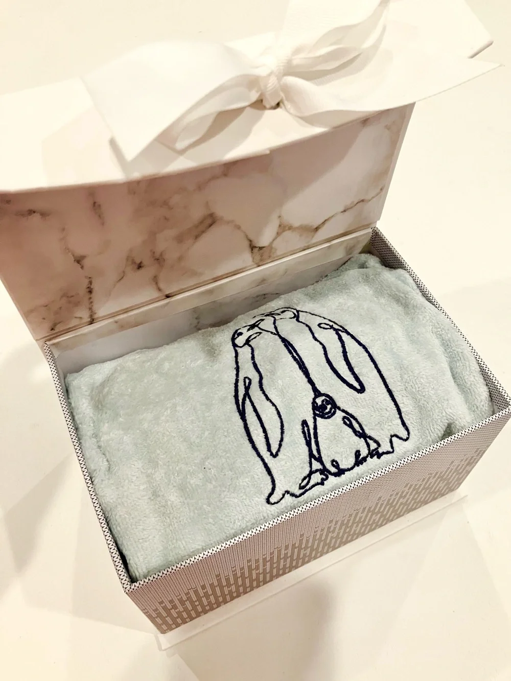 Light Blue Plush Throw with Embroidered Penguin Design